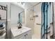 Clean bathroom with a shower/tub combo and updated vanity at 4809 Hemlock Sw Dr, Austell, GA 30106