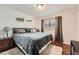 Calming bedroom with a king-size bed and hardwood floors at 4809 Hemlock Sw Dr, Austell, GA 30106