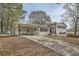 Ranch style home with carport and landscaped yard at 4809 Hemlock Sw Dr, Austell, GA 30106