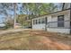 Brick home with covered porch and landscaping at 4809 Hemlock Sw Dr, Austell, GA 30106