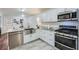 Modern kitchen featuring stainless steel appliances and granite countertops at 4809 Hemlock Sw Dr, Austell, GA 30106