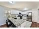 Updated kitchen with stainless steel appliances and granite countertops at 4809 Hemlock Sw Dr, Austell, GA 30106
