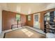 Sunroom featuring a built-in entertainment center and a door to the backyard at 4809 Hemlock Sw Dr, Austell, GA 30106