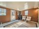 Bright sunroom with two comfy chairs and a small plant stand at 4809 Hemlock Sw Dr, Austell, GA 30106