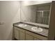 Bathroom with double vanity and large mirror at 449 Broder Farms Dr, Stockbridge, GA 30281