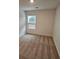 Well-lit bedroom featuring carpeted floor and window at 449 Broder Farms Dr, Stockbridge, GA 30281