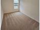 Spacious bedroom with carpeted floor and window at 449 Broder Farms Dr, Stockbridge, GA 30281
