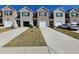 New townhome community with inviting front yards and attached garages at 449 Broder Farms Dr, Stockbridge, GA 30281