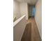 Upstairs hallway with carpeted flooring and access to bedrooms at 449 Broder Farms Dr, Stockbridge, GA 30281