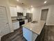 Spacious kitchen with granite island and stainless steel appliances at 449 Broder Farms Dr, Stockbridge, GA 30281