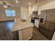 Open concept kitchen with granite island and stainless steel appliances at 449 Broder Farms Dr, Stockbridge, GA 30281