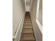 Carpeted staircase leading to the second floor at 449 Broder Farms Dr, Stockbridge, GA 30281