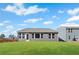 Expansive backyard featuring a pristine lawn and a home with abundant windows and a gray exterior at 1002 Rainier Dr, Euharlee, GA 30145