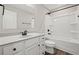 Bright bathroom with white vanity, shower, dark hardware and ample lighting at 1002 Rainier Dr, Euharlee, GA 30145
