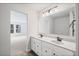 Well-lit bathroom with double sink vanity, framed mirror, and an open view to the bedroom at 1002 Rainier Dr, Euharlee, GA 30145