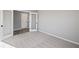Inviting bedroom featuring plush carpet, french doors, and soothing neutral paint at 1002 Rainier Dr, Euharlee, GA 30145