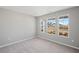 Bright bedroom filled with natural light with view of the outdoors through a set of windows at 1002 Rainier Dr, Euharlee, GA 30145