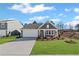 Charming single-story home with a well-manicured lawn and attached two car garage at 1002 Rainier Dr, Euharlee, GA 30145