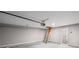 Spacious garage featuring an automatic door opener and attic access via a pull-down ladder at 1002 Rainier Dr, Euharlee, GA 30145