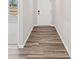 Hallway featuring luxury vinyl plank flooring leading to bedroom at 1002 Rainier Dr, Euharlee, GA 30145