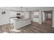 Kitchen with gray cabinets, granite countertops, stainless steel appliances, and an island at 1002 Rainier Dr, Euharlee, GA 30145