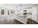 Bright kitchen features an island with granite counters, stainless appliances, and ample cabinet space at 1002 Rainier Dr, Euharlee, GA 30145