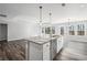 Kitchen island features granite counters, stainless steel sink, and ample storage space at 1002 Rainier Dr, Euharlee, GA 30145