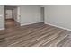 Large living area with gray walls and wood look flooring at 1002 Rainier Dr, Euharlee, GA 30145