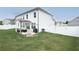Spacious backyard with patio, grill, and white vinyl fence at 301 Rexmere Rd, Mcdonough, GA 30252
