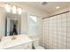 Bright bathroom with shower/tub combo and window at 301 Rexmere Rd, Mcdonough, GA 30252