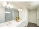 Double vanity bathroom with a large mirror and marble shower at 301 Rexmere Rd, Mcdonough, GA 30252