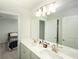 Double vanity bathroom with a large mirror and an adjacent bedroom at 301 Rexmere Rd, Mcdonough, GA 30252