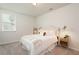 Spacious bedroom with white bedding and a bedside table at 301 Rexmere Rd, Mcdonough, GA 30252