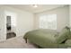 Cozy bedroom with green bedding and an ensuite bathroom at 301 Rexmere Rd, Mcdonough, GA 30252