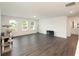 Spacious bonus room with dark hardwood floors and a view of the backyard at 301 Rexmere Rd, Mcdonough, GA 30252
