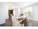 Farmhouse dining room with a long wooden table and bench seating at 301 Rexmere Rd, Mcdonough, GA 30252
