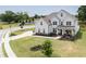 Two-story white farmhouse with gray roof and landscaping at 301 Rexmere Rd, Mcdonough, GA 30252