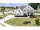Two-story farmhouse with stone accents and a large front yard at 301 Rexmere Rd, Mcdonough, GA 30252