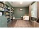 Cozy home office features built-in shelves and a comfortable reading chair at 301 Rexmere Rd, Mcdonough, GA 30252