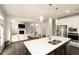 Open concept kitchen with large island and view of living room at 301 Rexmere Rd, Mcdonough, GA 30252