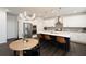 Eat-in kitchen with island, white cabinets, and hardwood floors at 301 Rexmere Rd, Mcdonough, GA 30252