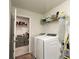 Laundry room with washer, dryer, and shelving at 301 Rexmere Rd, Mcdonough, GA 30252