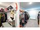 Large walk-in closet with double hanging rods and shelving at 301 Rexmere Rd, Mcdonough, GA 30252