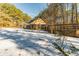Ranch home with screened porch and snowy backyard at 570 Pleasant Grove Rd, Mcdonough, GA 30252