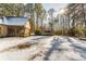 Snow-covered backyard with deck and wooded area at 570 Pleasant Grove Rd, Mcdonough, GA 30252