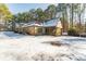 Brick home with screened porch and snowy backyard at 570 Pleasant Grove Rd, Mcdonough, GA 30252