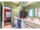 Double vanity bathroom with a view into a bedroom at 570 Pleasant Grove Rd, Mcdonough, GA 30252