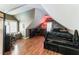 Large bedroom with sloped ceilings, hardwood floors, and a fireplace at 570 Pleasant Grove Rd, Mcdonough, GA 30252