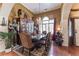 Formal dining room with a dark wood table and unique decor at 570 Pleasant Grove Rd, Mcdonough, GA 30252