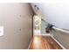 Hallway leading to bathroom with laminate flooring at 570 Pleasant Grove Rd, Mcdonough, GA 30252